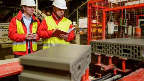 Engineers monitoring a clay block production