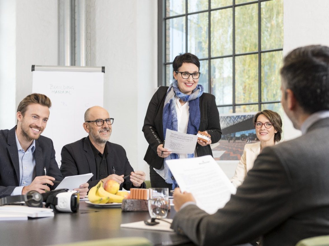 Business people talking about new building projects in a meeting room