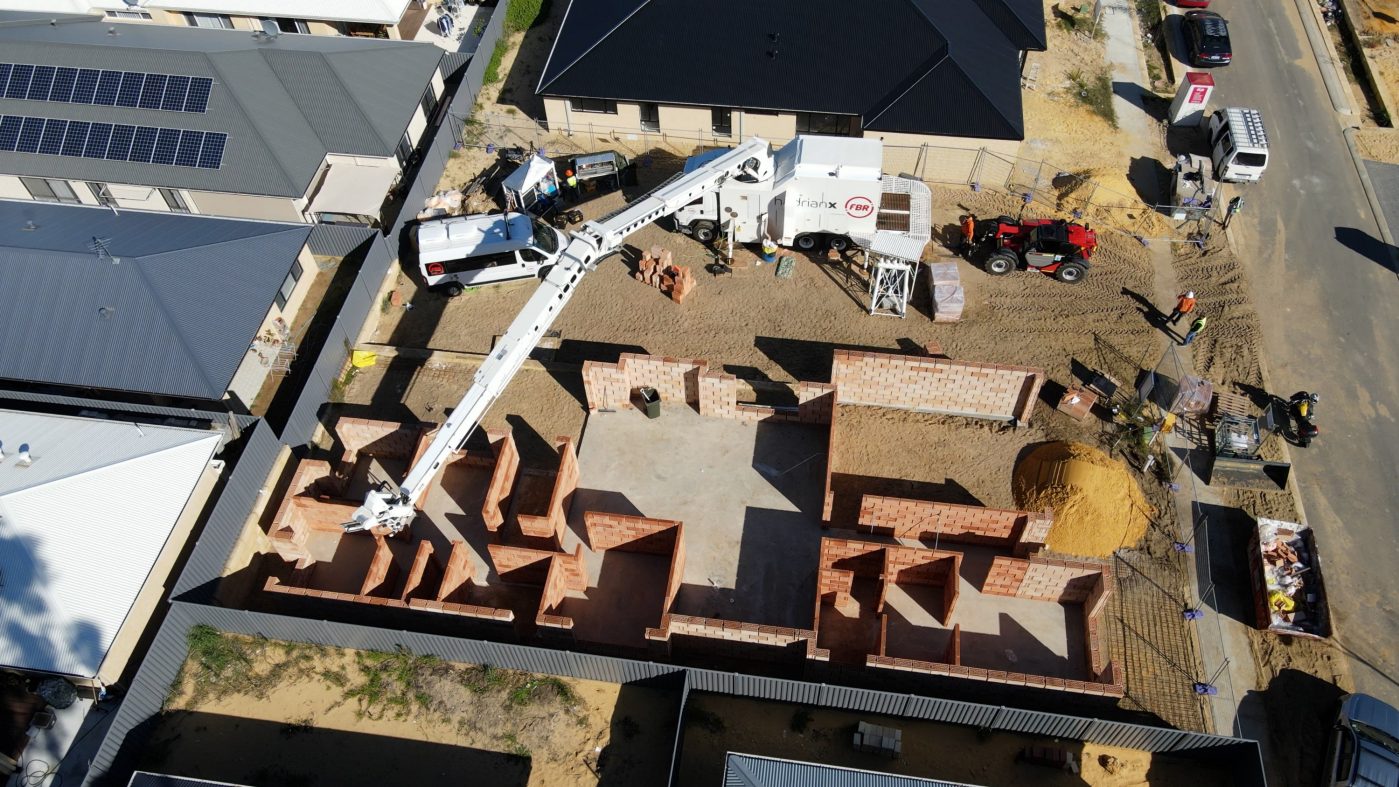 Hadrian X robot setting bricks, from above