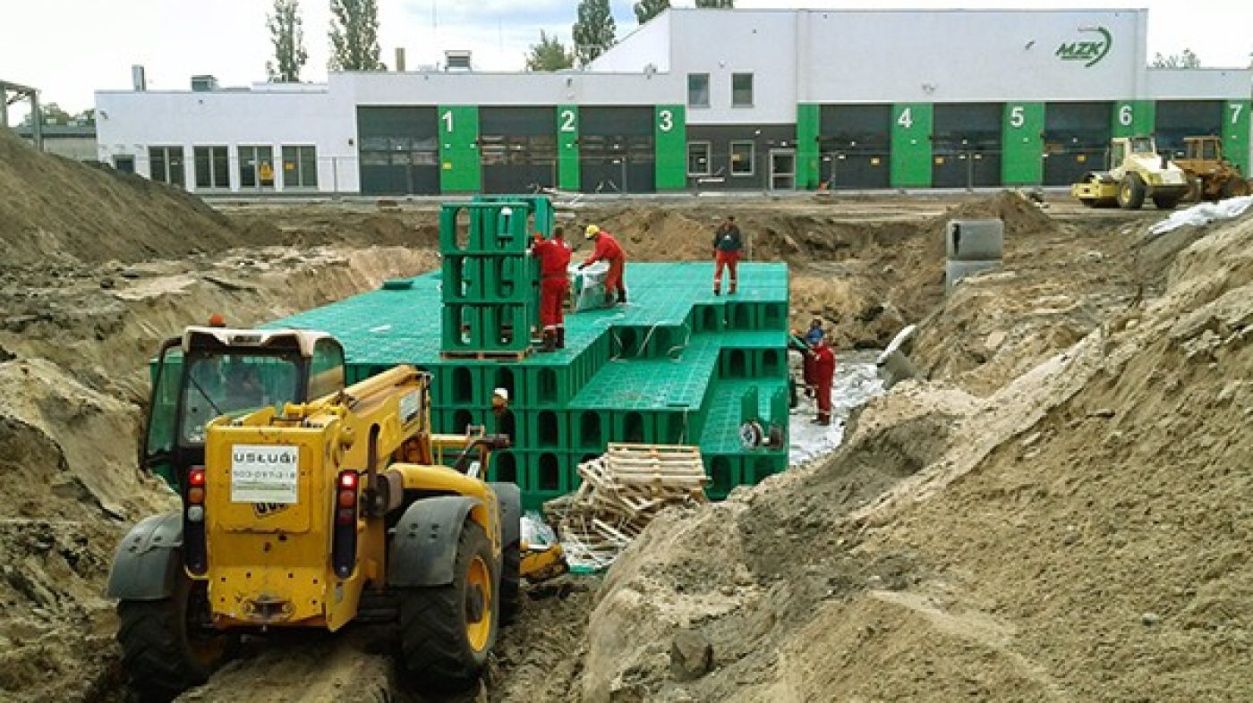 stormboxes beeing buried; excavator