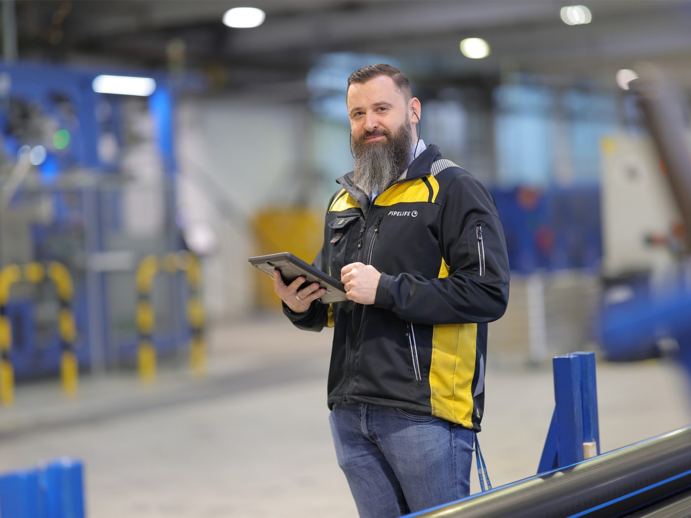 two women in an office smiling into camera