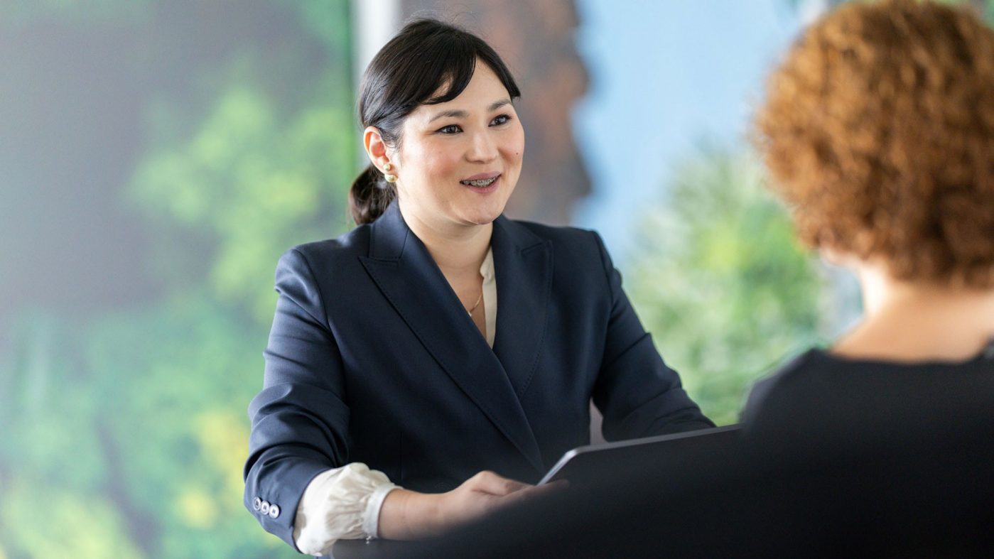 A woman talking with another woman