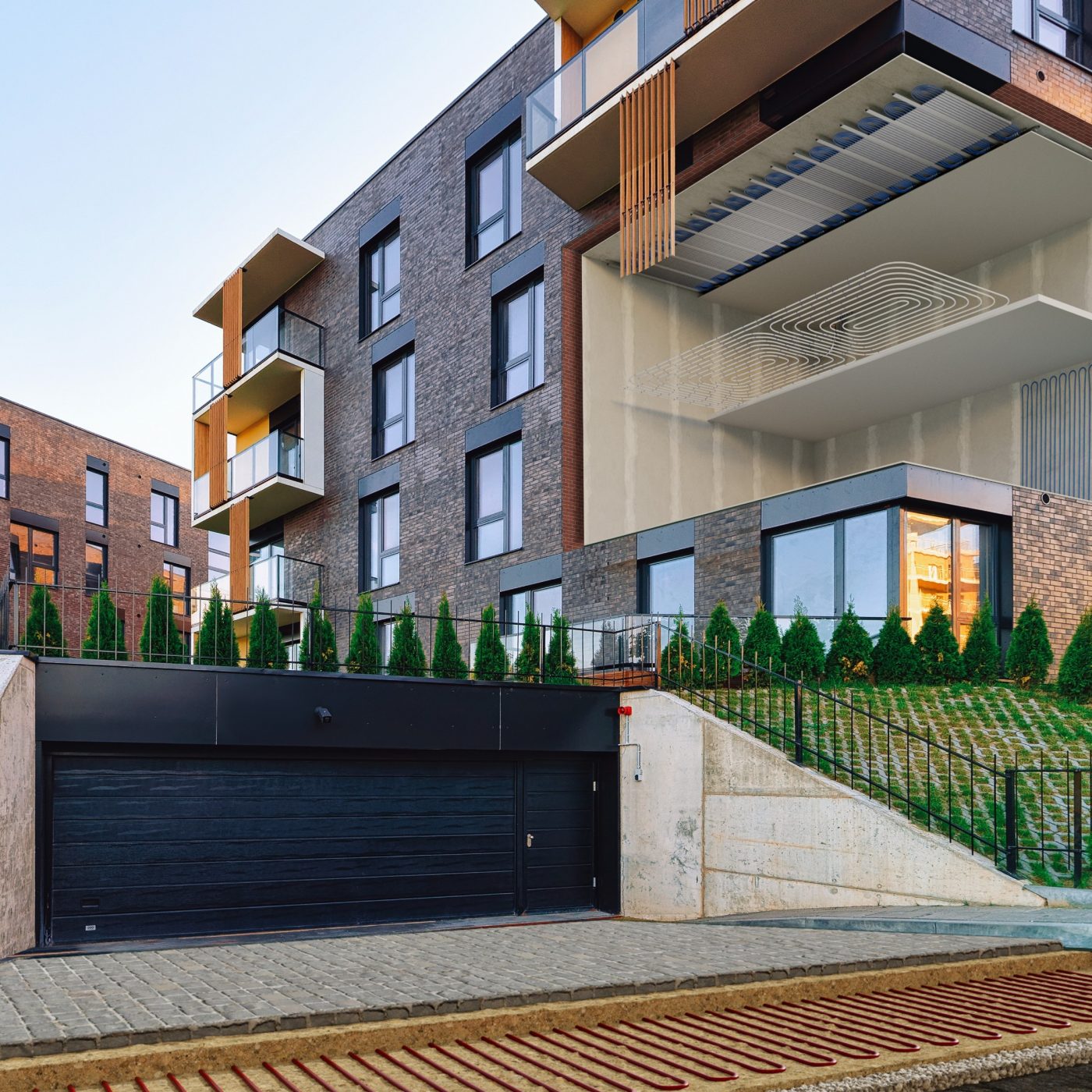 Modern residential home apartment building architecture with garage. House and parking concept.