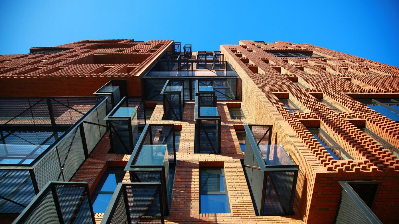 modern brick building with black metal and glas elements