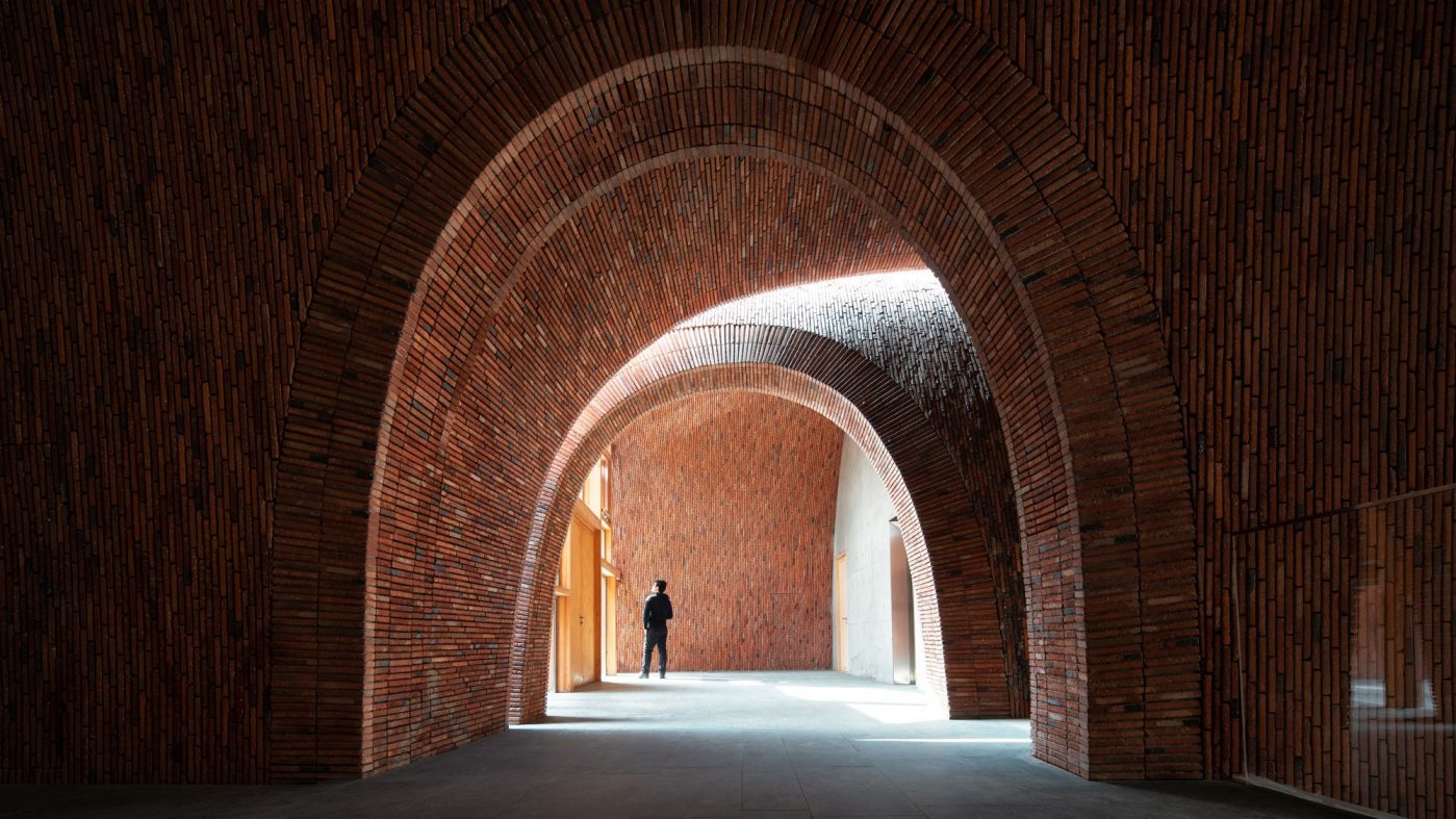 Jingdezhen Imperial Kiln Museum in China with arched structure system made up of concrete poured in between two layers masonry brick walls