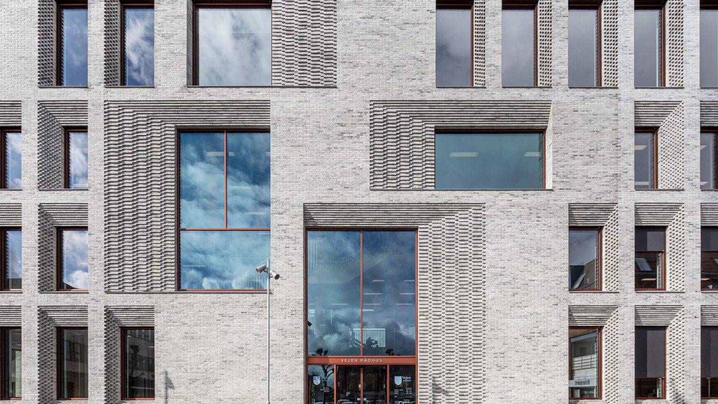 grey brick building with windows