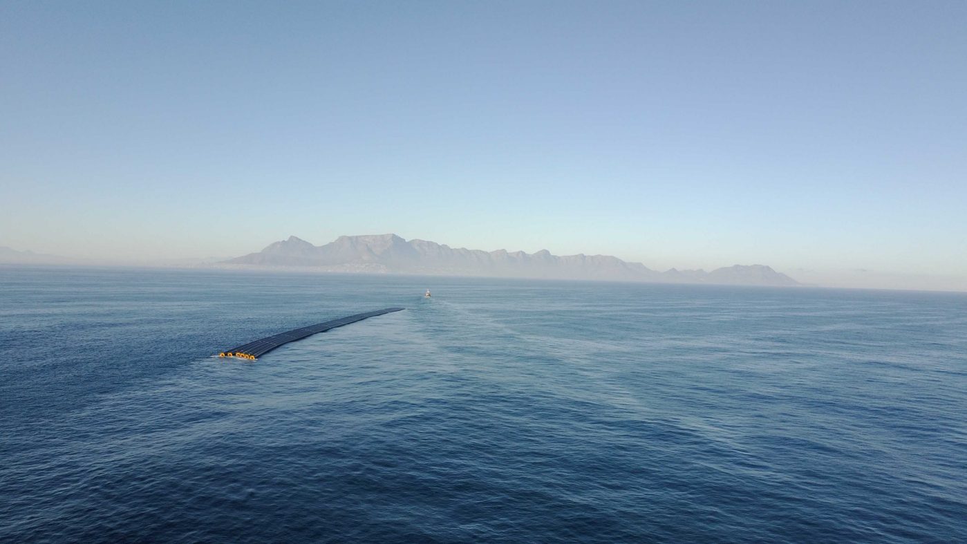 Ship pulling pipes on the sea