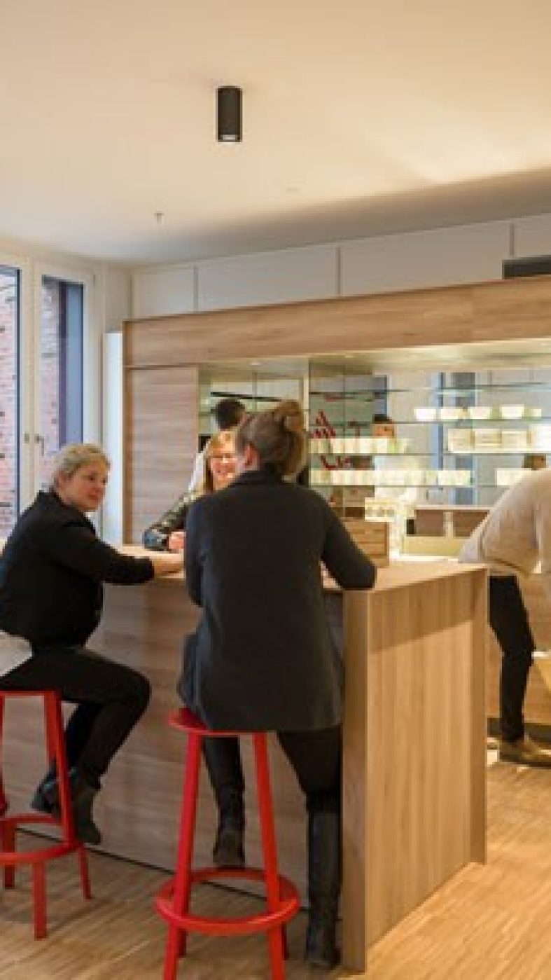 Employees chat in the cafeteria
