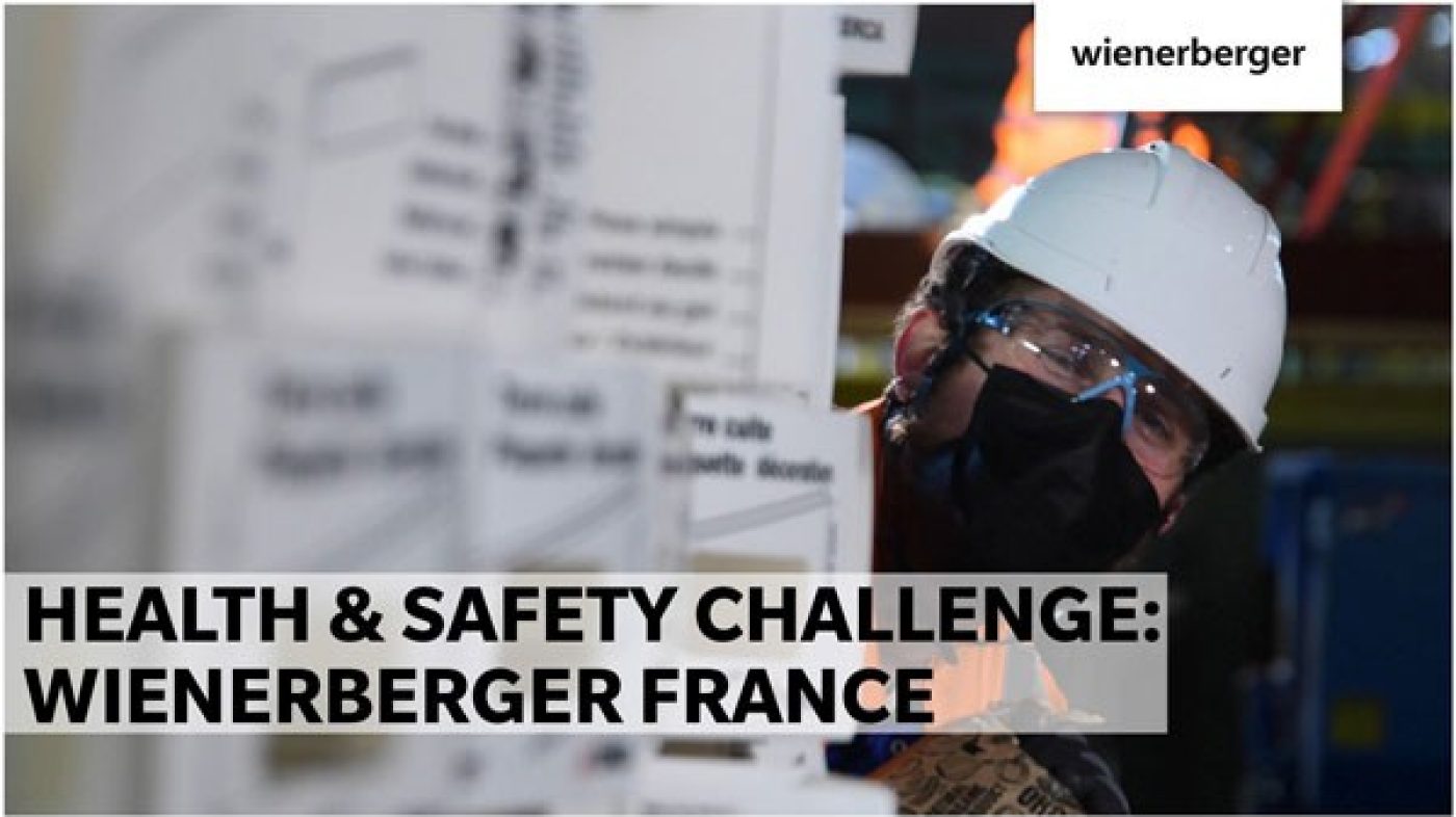 Man with goggles is peeking around the corner