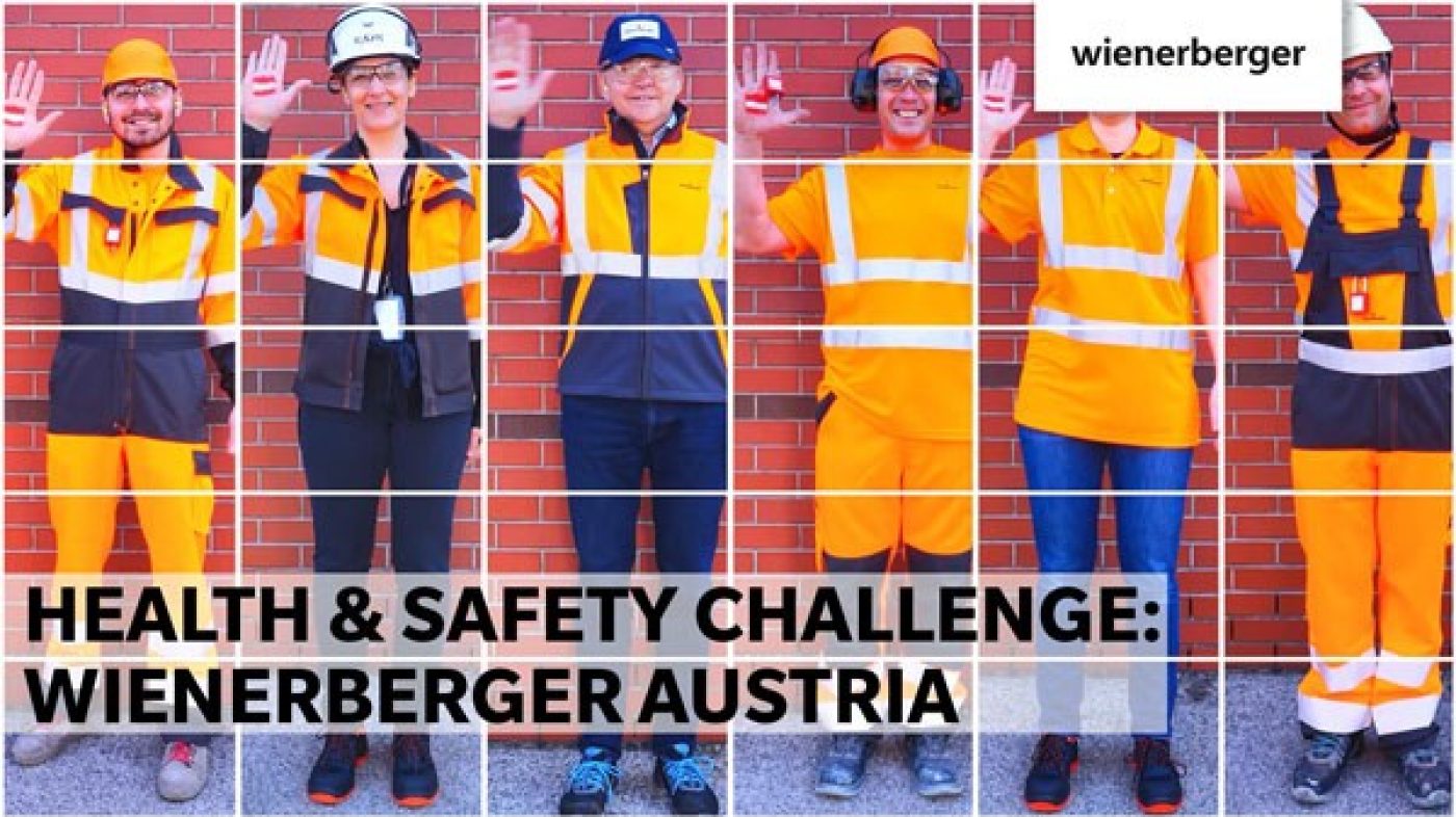 Six people in protective clothing stand next to each other