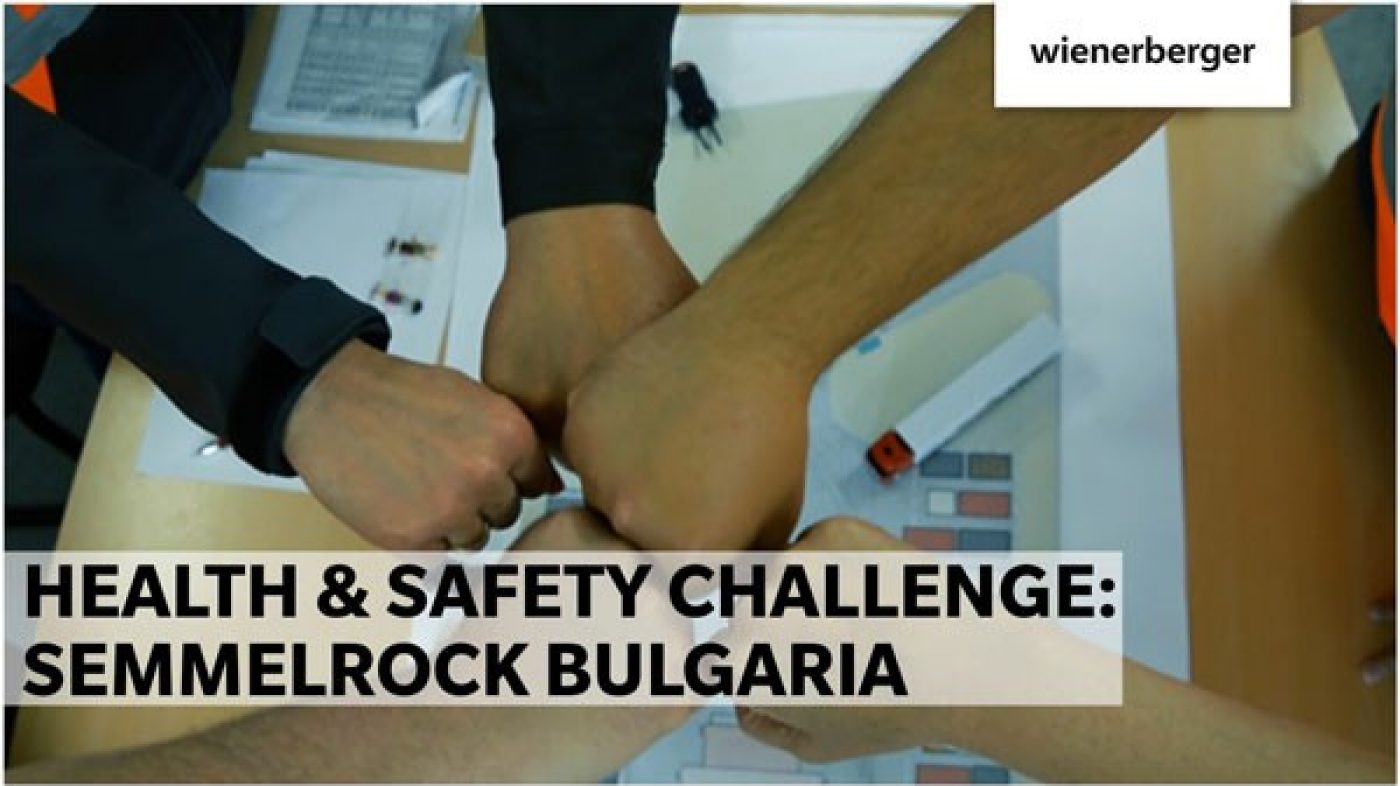 Five fists arranged in a circle