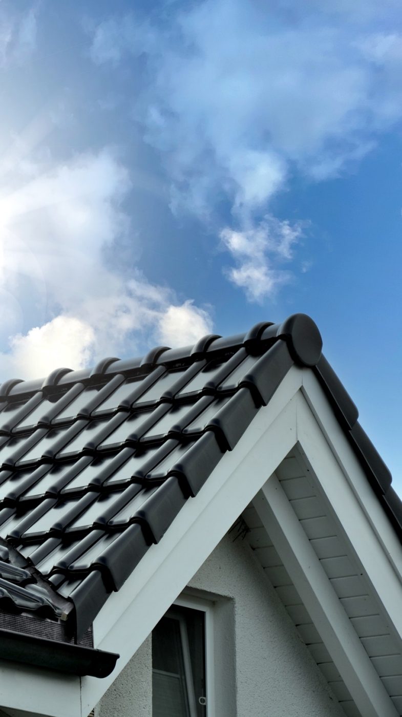 blacl solar tile roof, blue sky