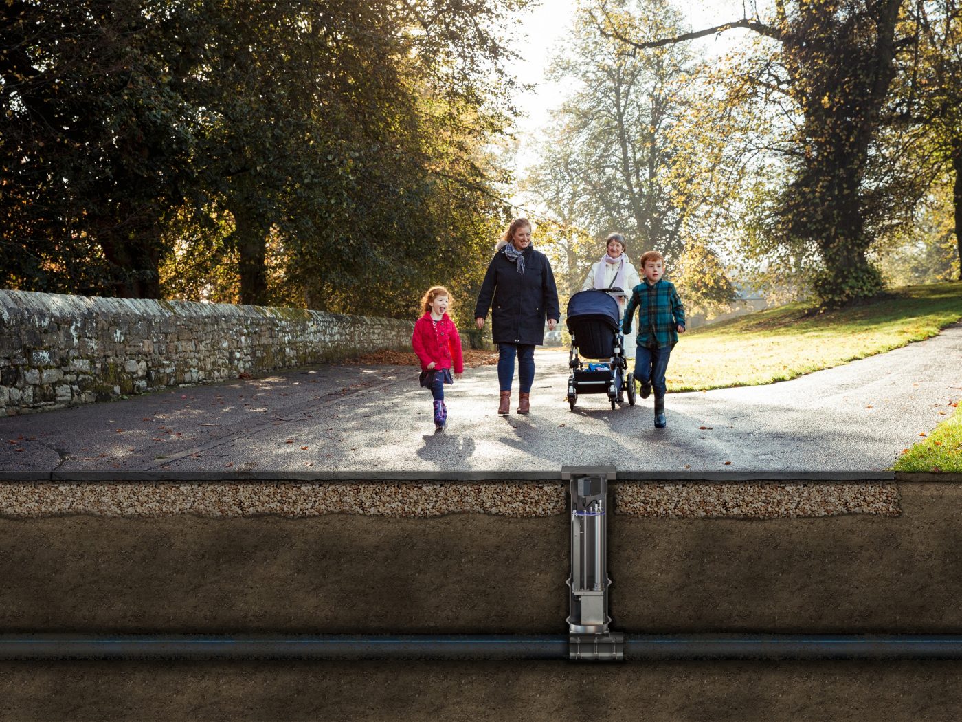 Two women with kids in park with illustration of underground water management