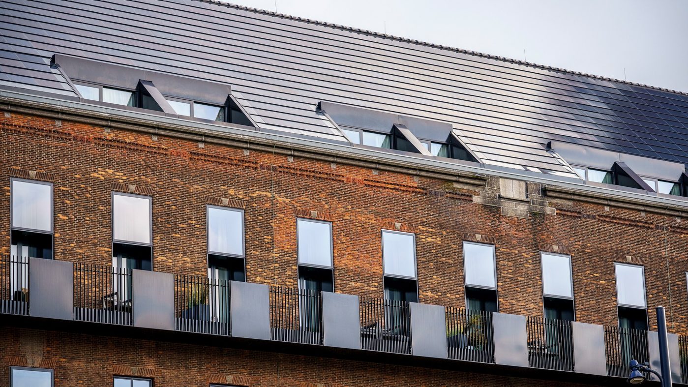 Solar roof tiles on a brick building
