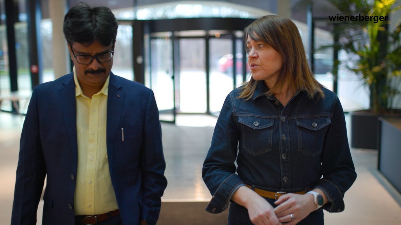 Woman talking with a man while walking