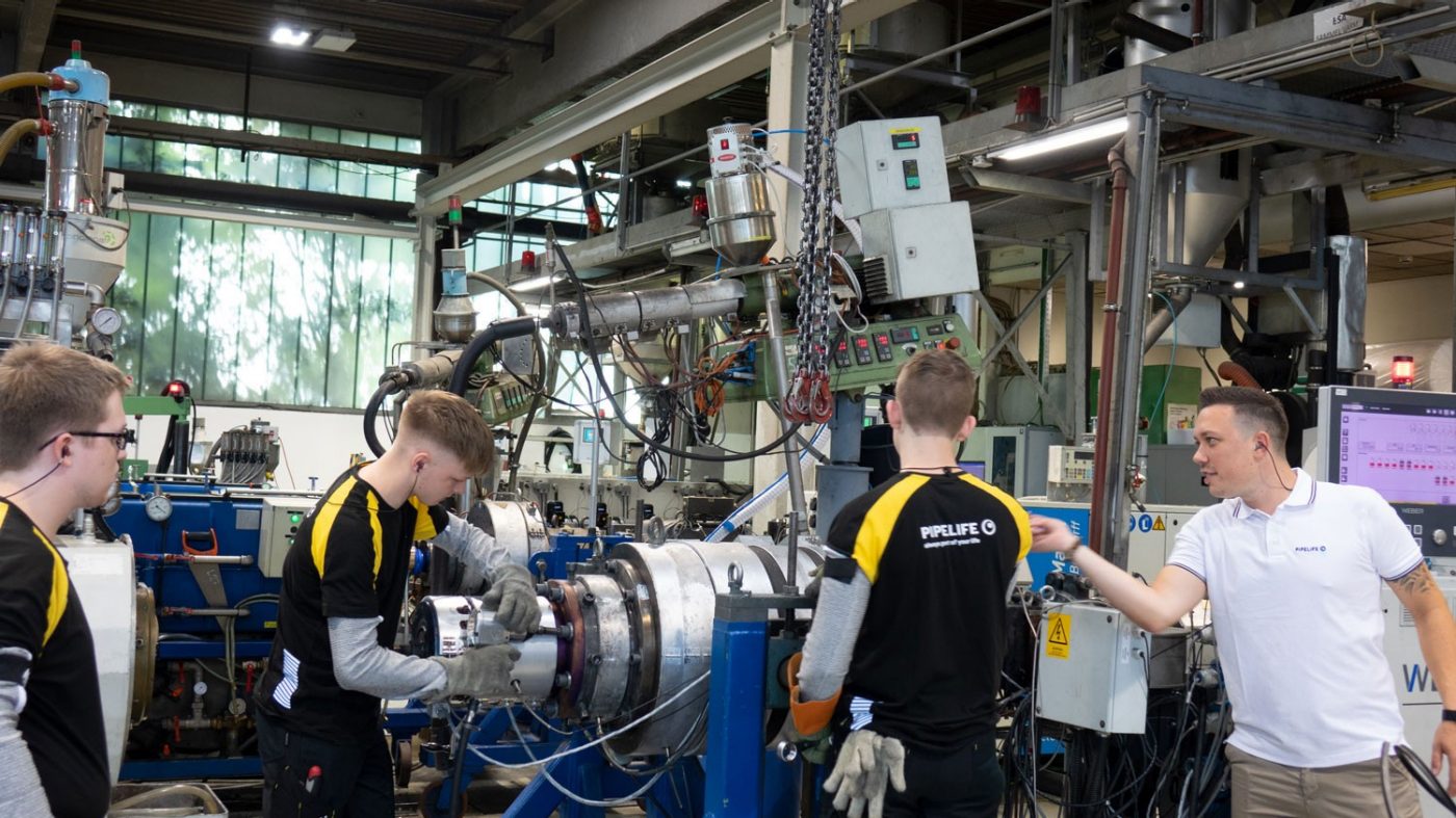Apprentices working on equipment
