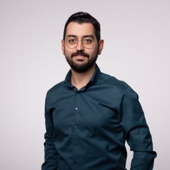 Portrait, man with black hair, beard and glasses