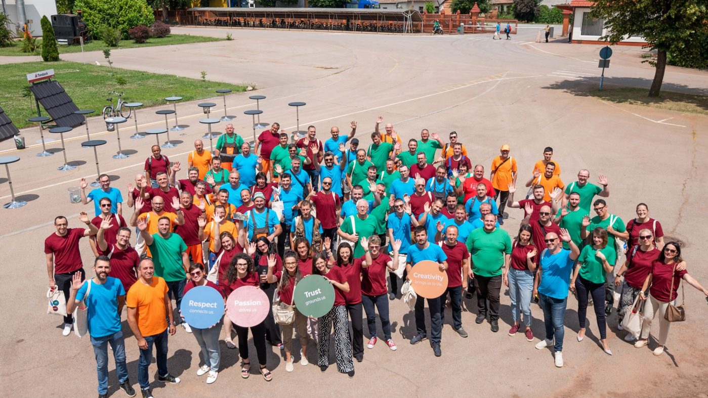 employees in colorful t-shirts