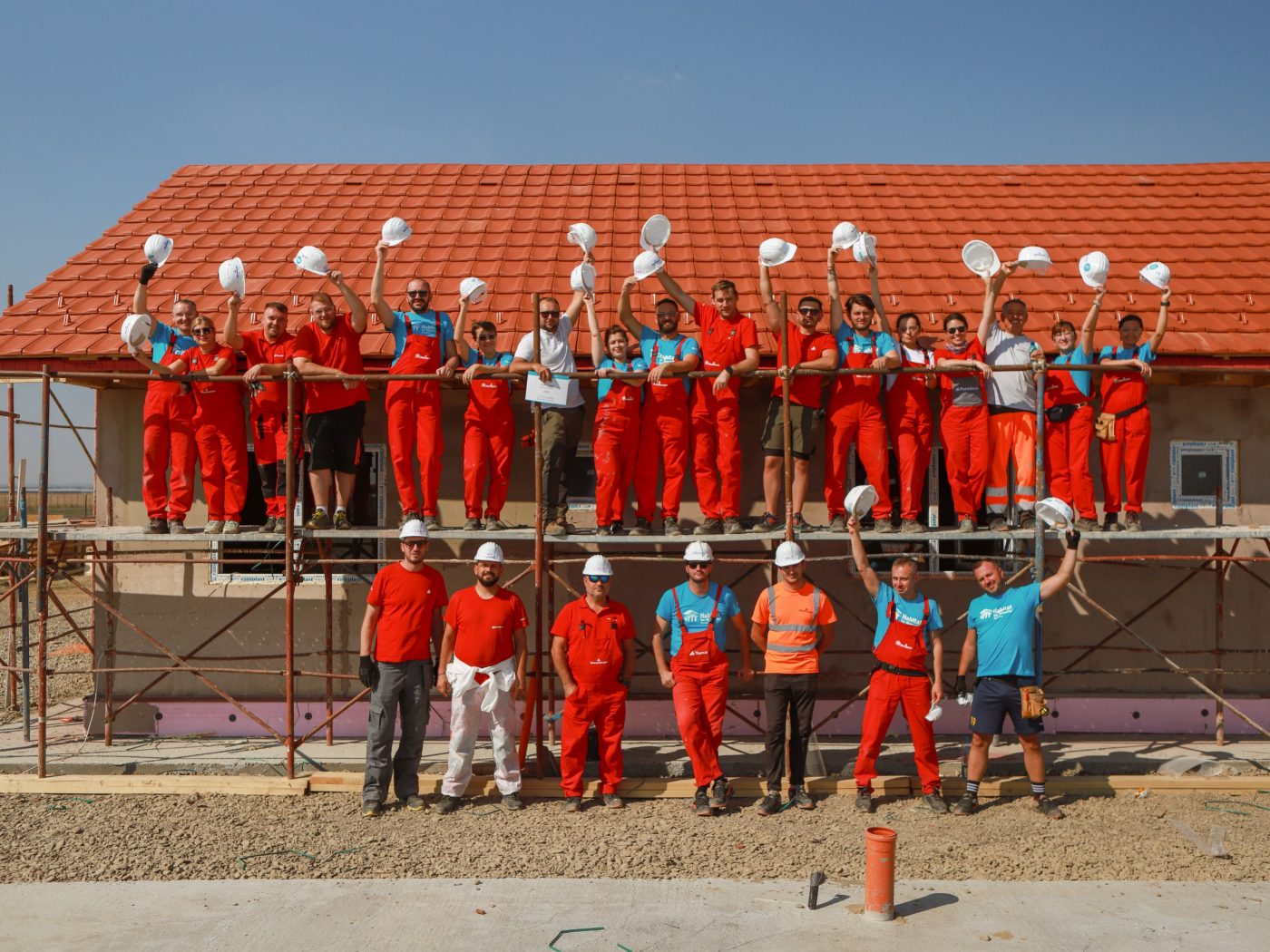 people cheering on a construction site