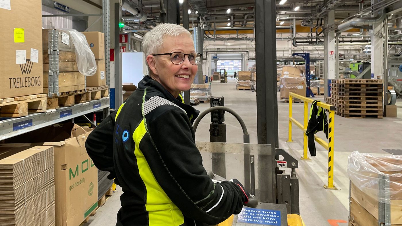 Woman on lifting cart