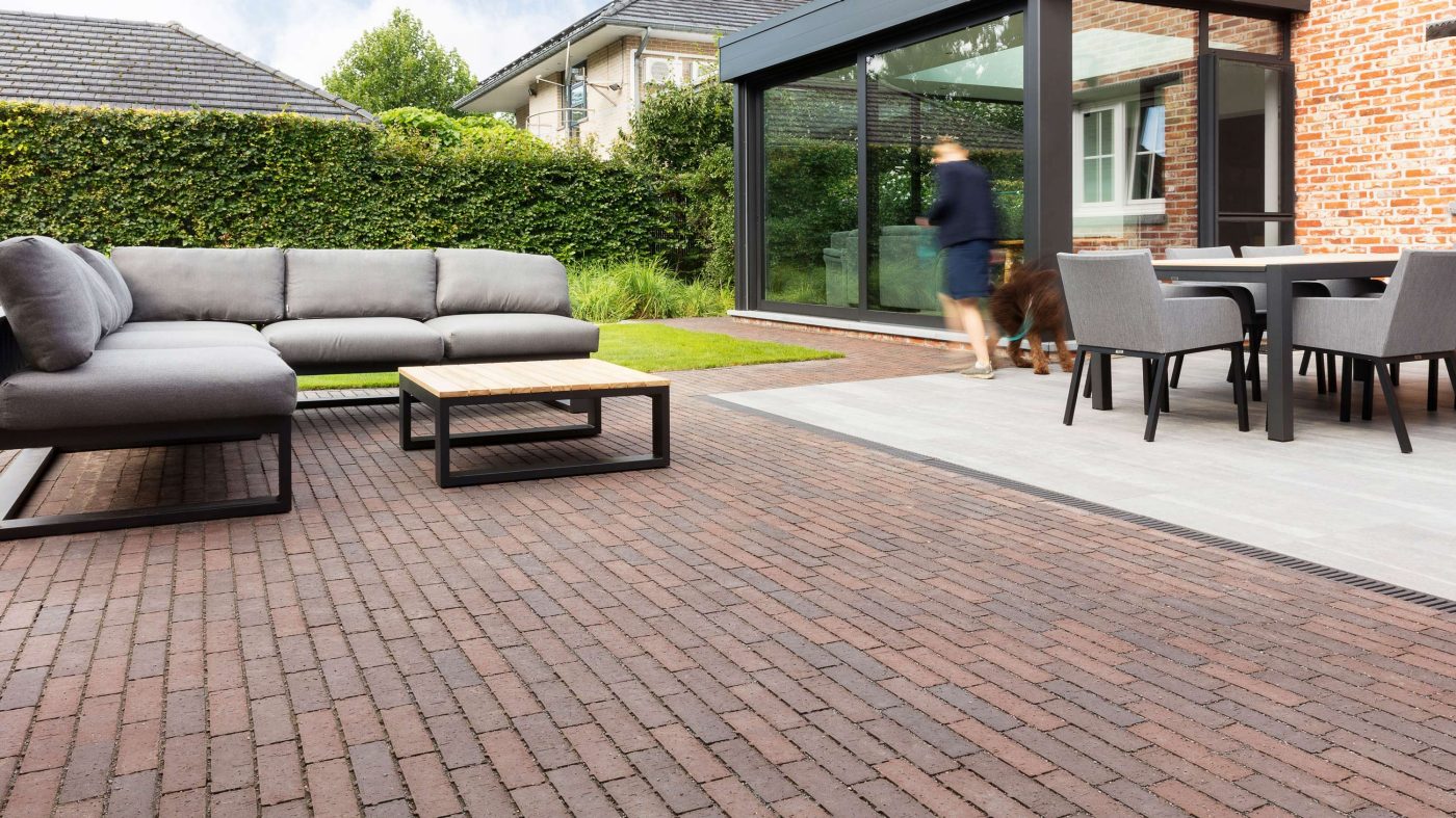 A terrace with red-brown pavers